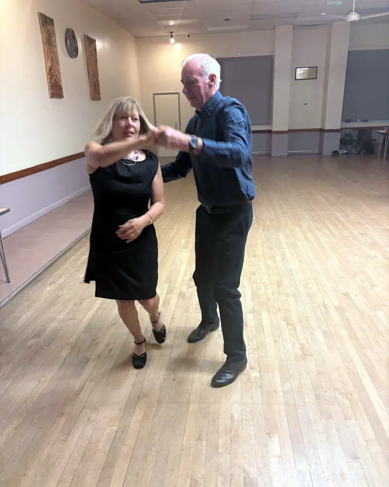 A couple from Justyna's class dancing in the hall