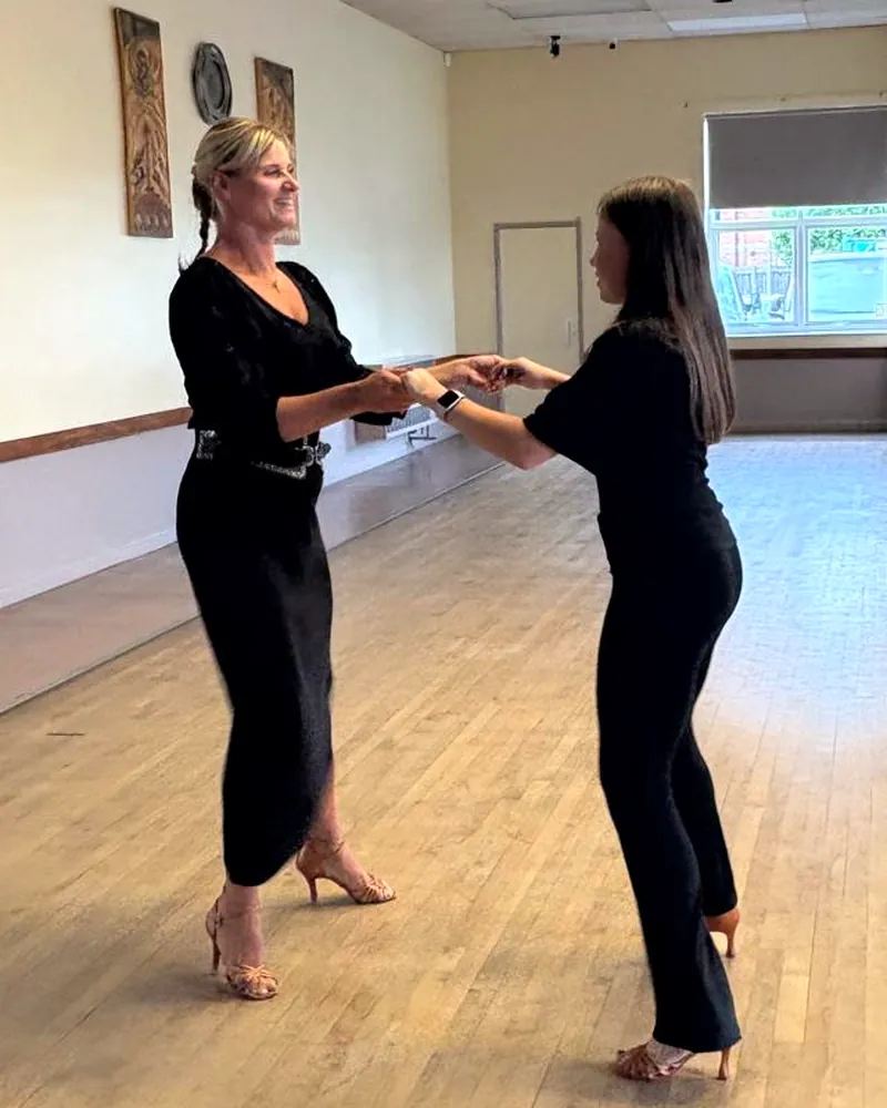 Justyna dancing with a student in class at Washingborough Community Centre
